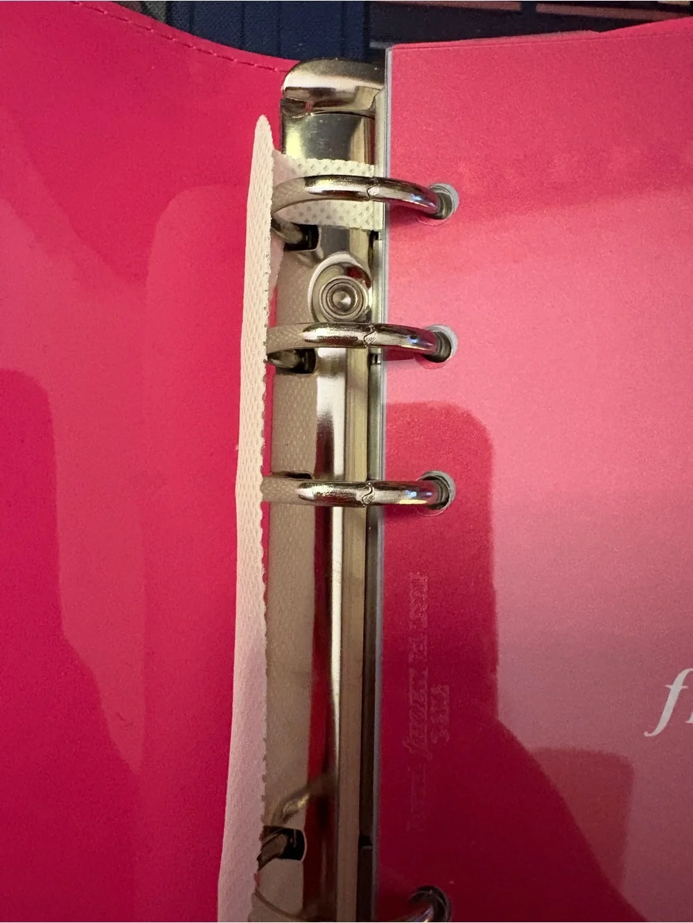 Filofax domino in pink, patent leather, personal size.
